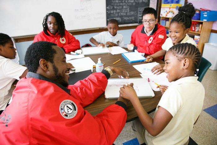 group of city year volunteers working with students