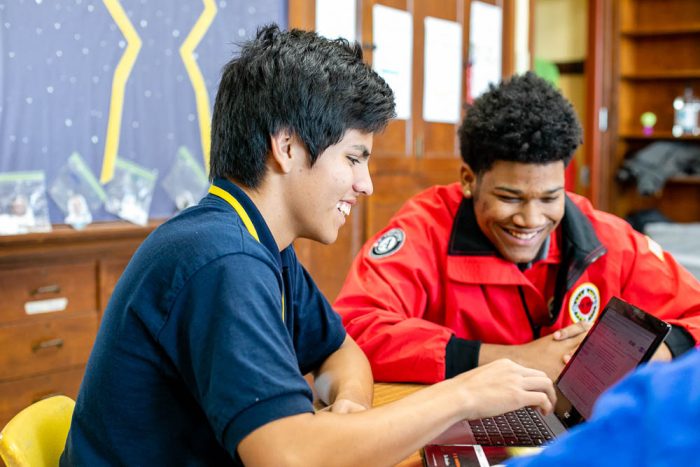 city year volunteer working with a student