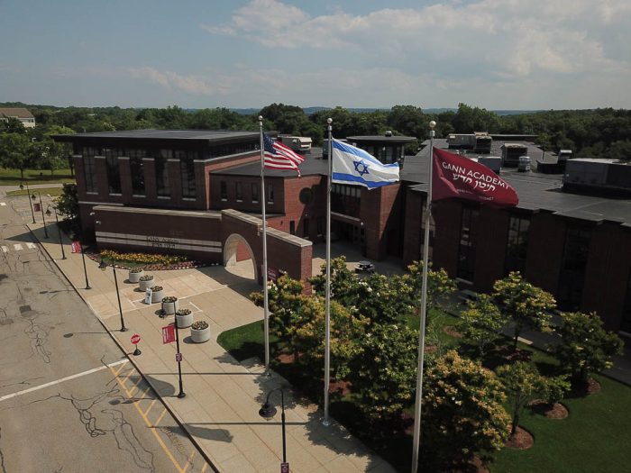 aerial view of gann academy with the american flag israeli flag on display