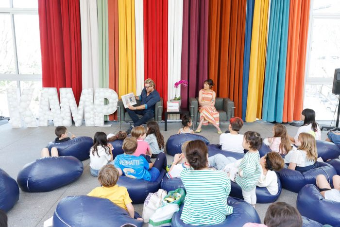 a group of children being taught by a Hammer Museum camp caounselor