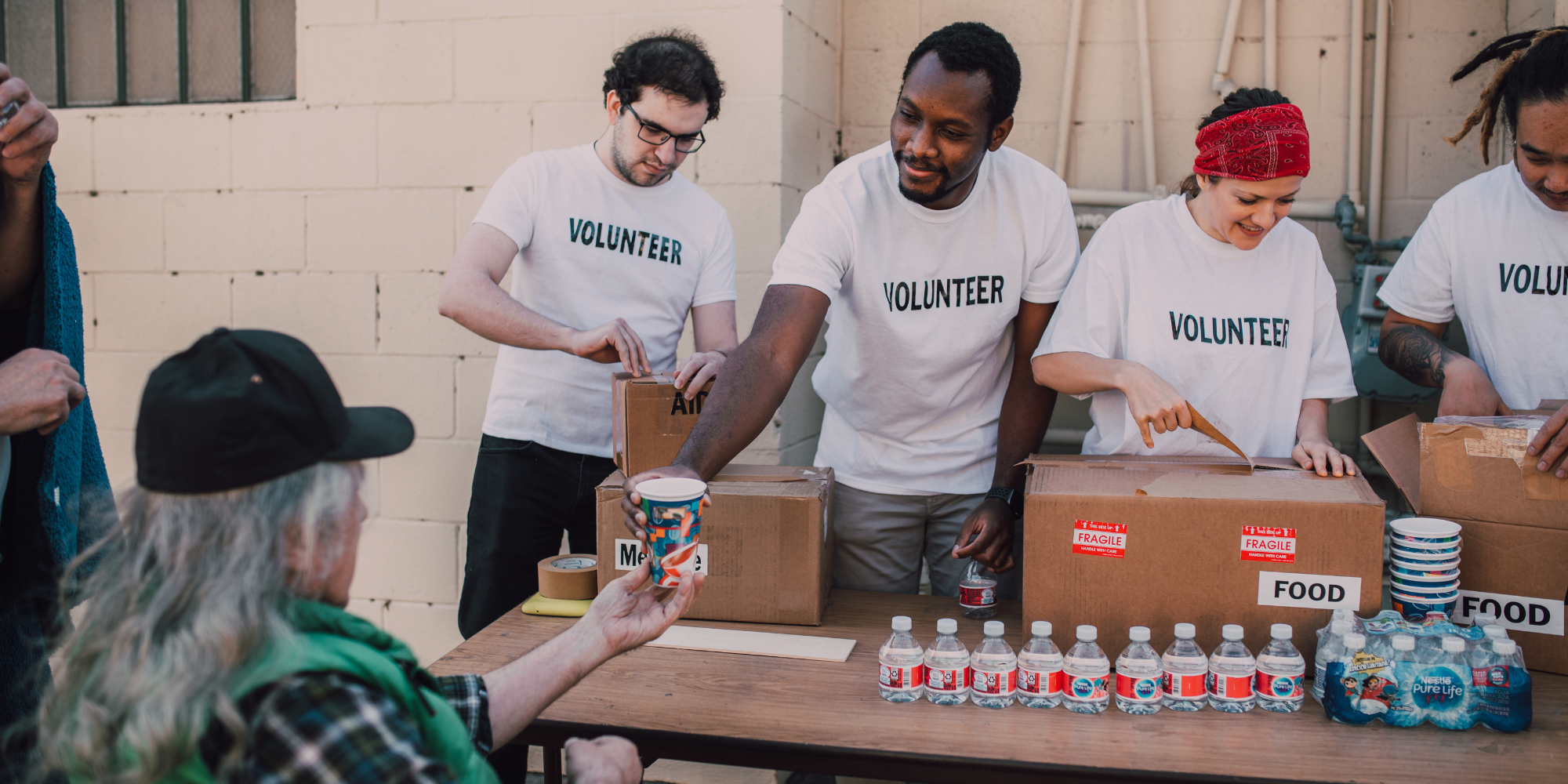 Volunteers hand out food