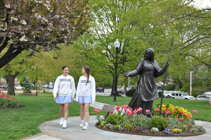 Ursuline School two girls walking in a garden